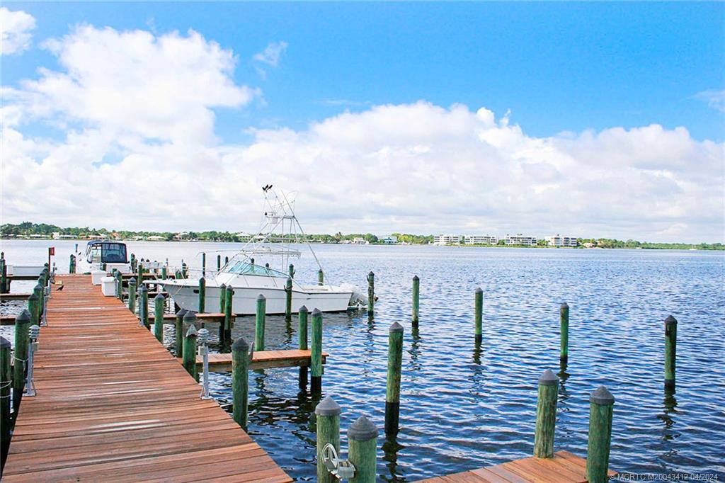 1864 Southwest Palm City Road, Unit 202 Stuart, FL 34994 - Photo 28 of 29 a view of roof deck with outdoor seating and city view