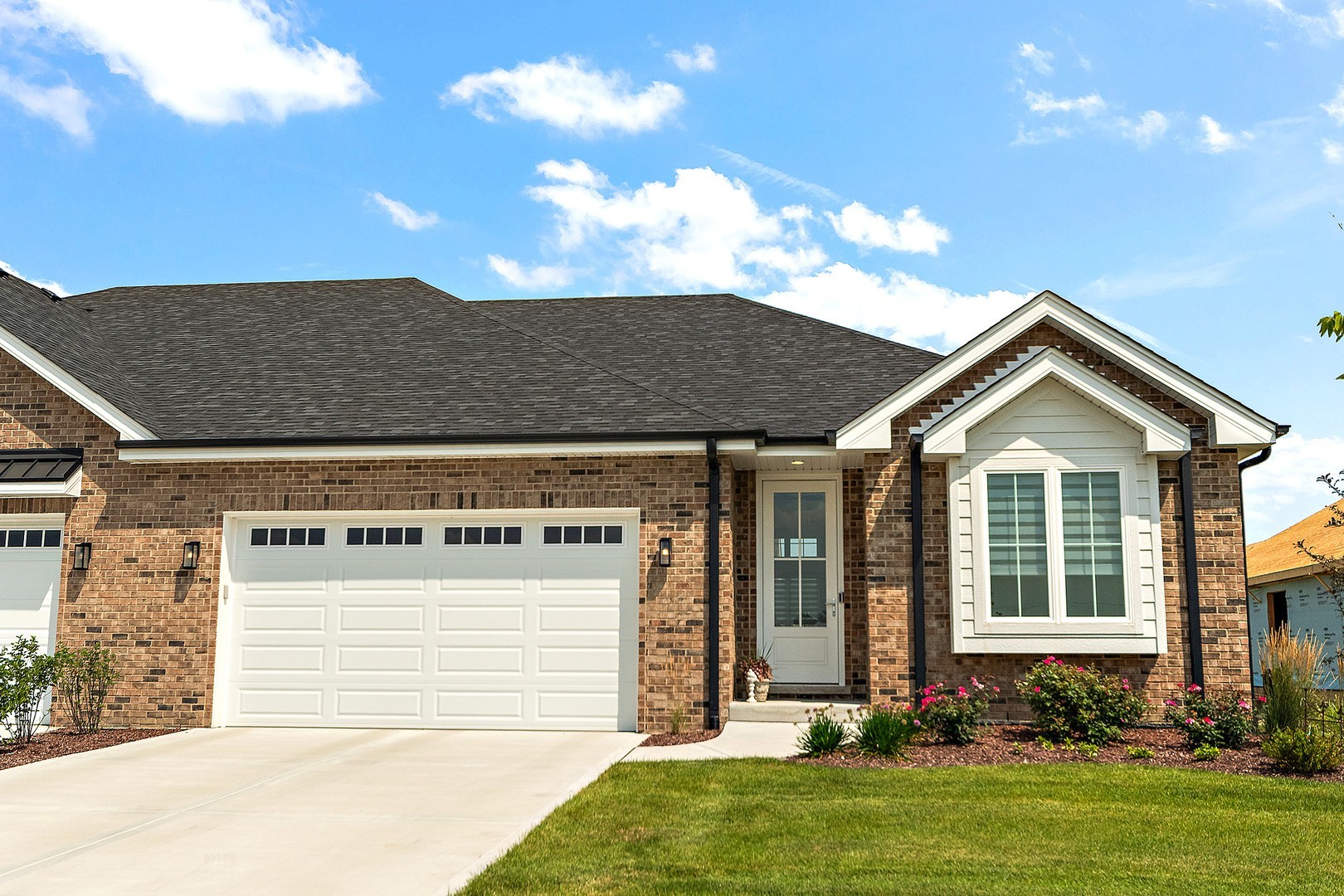 12185 Morandi Court Lemont, IL 60439 - Photo 1 of 13 a front view of a house with a yard