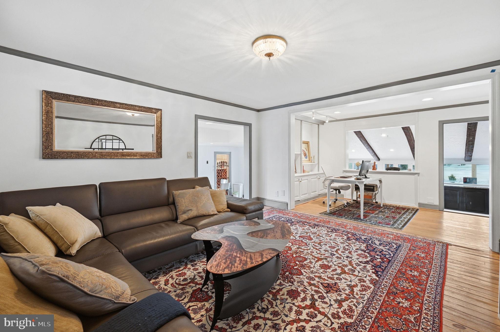 11641 Glen Road Potomac, MD 20854 - Photo 6 of 40 a living room with furniture and wooden floor