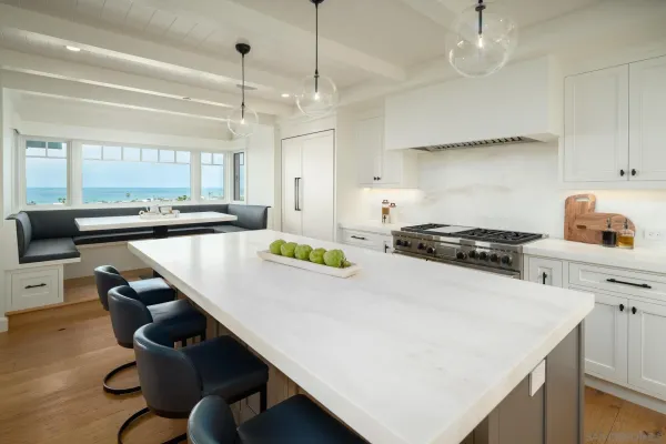 a room with a table chairs and wooden floor