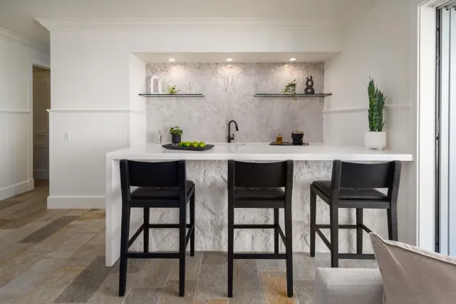 a kitchen with a table and chairs in it