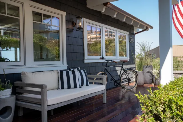 a view of a two chair in the patio of the house