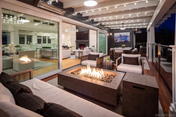 a outdoor living space with furniture and a fireplace
