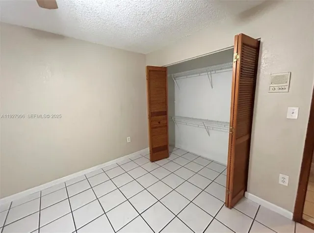 a bathroom with a black and white toilet