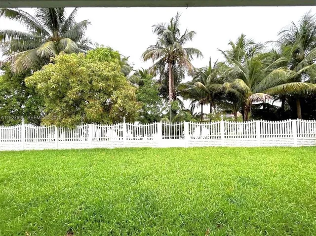 a view of a park with houses