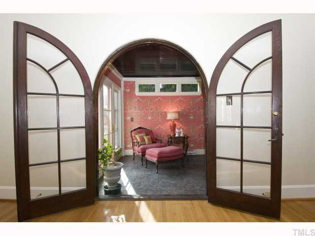 3936 Dover Road Durham, NC 27707 - Photo 5 of 12 Arched wooden interior doors are obviously custom designed and construction. They are magnificent. Original wood doors that access private areas, are the vernacular board and batten. Sun Room