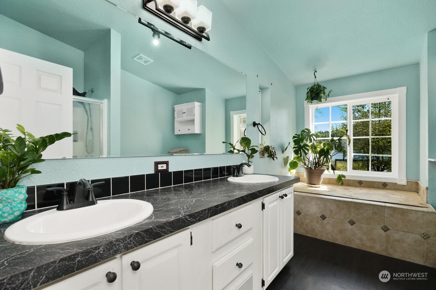 1722 Sunday Lake Road Stanwood, WA 98292 - Photo 16 of 32 a bathroom with a granite countertop sink and a mirror