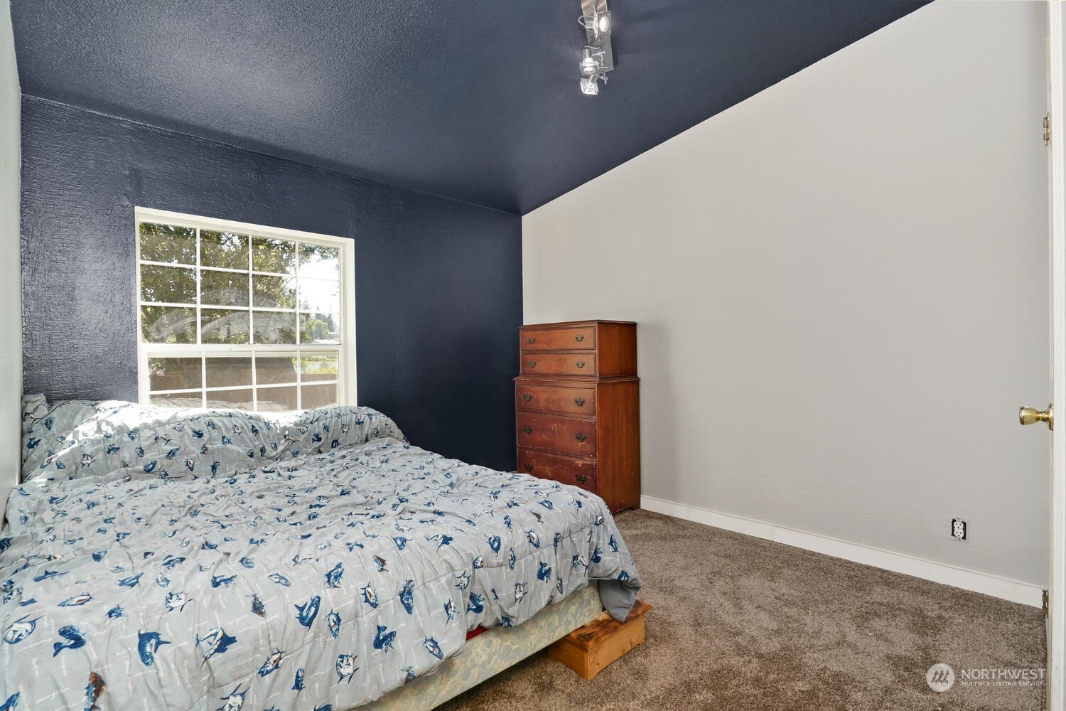 1722 Sunday Lake Road Stanwood, WA 98292 - Photo 17 of 32 a bedroom with a bed and a window