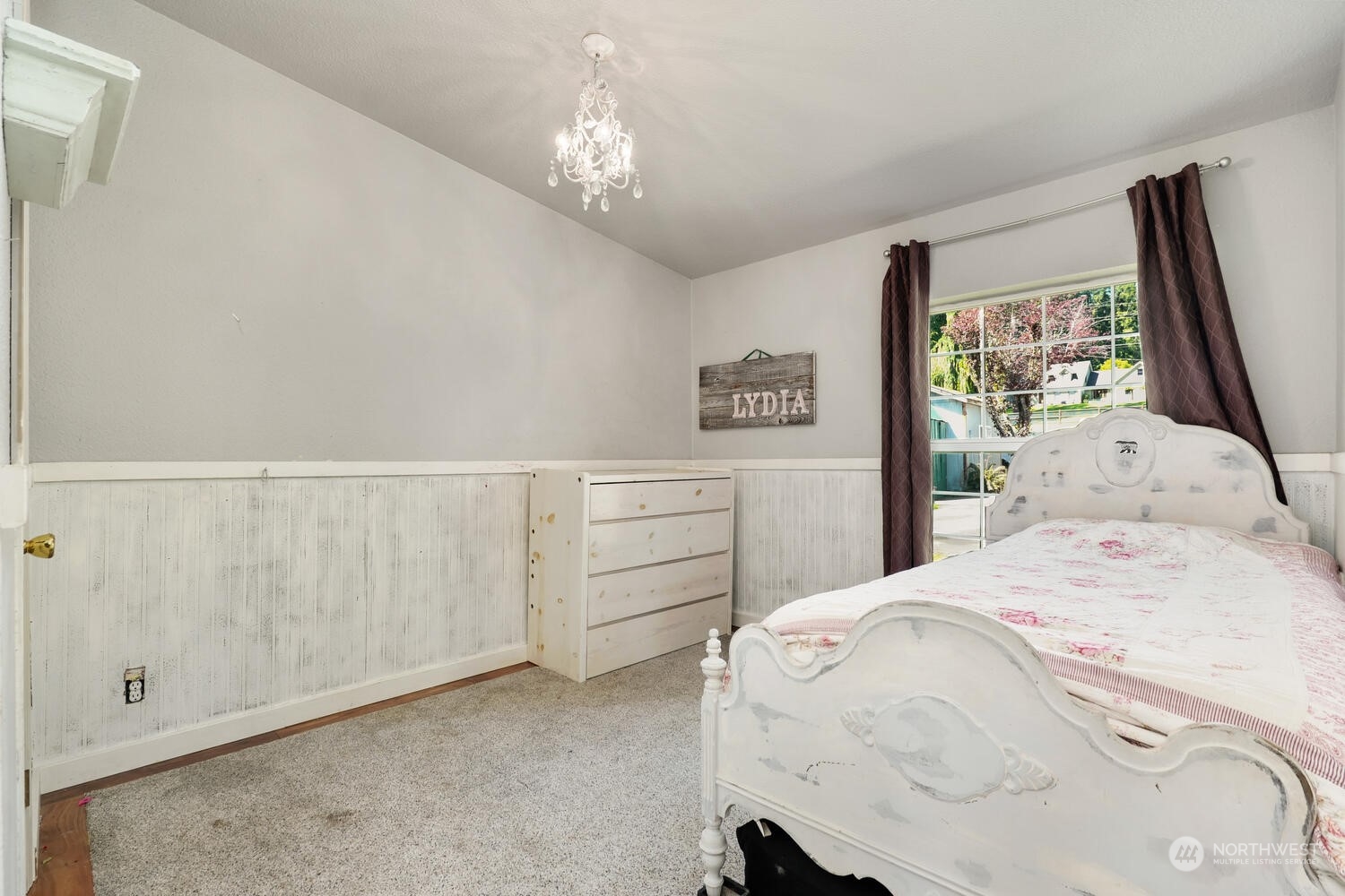 1722 Sunday Lake Road Stanwood, WA 98292 - Photo 19 of 32 a bedroom with a bed and a chandelier