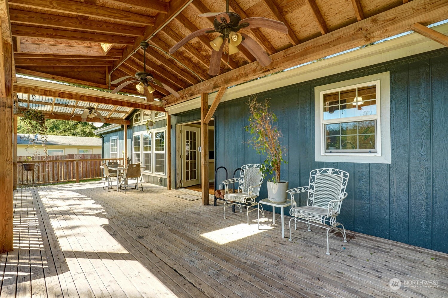 1722 Sunday Lake Road Stanwood, WA 98292 - Photo 21 of 32 a view of a dinning table and chairs in patio of the house