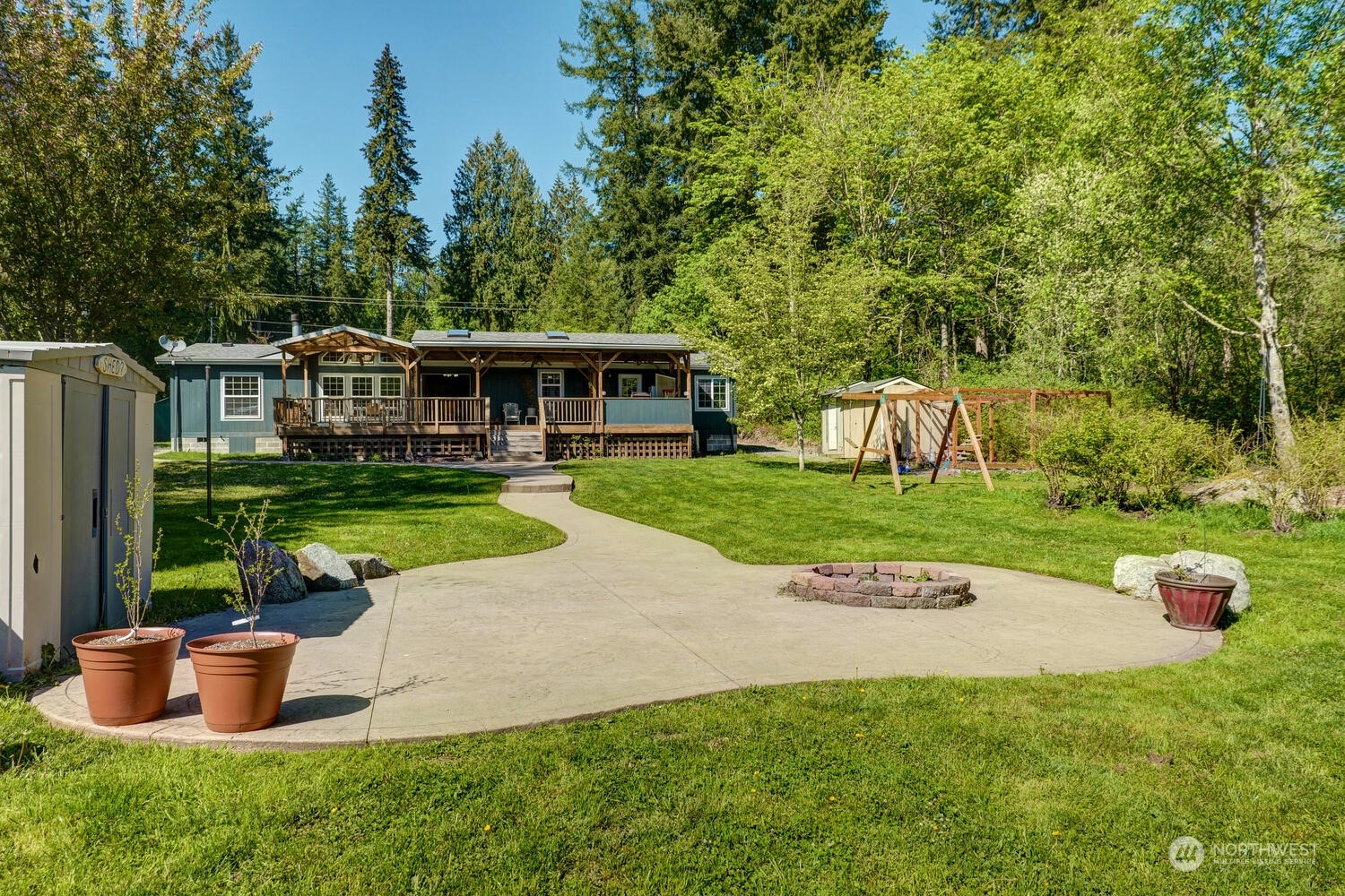 1722 Sunday Lake Road Stanwood, WA 98292 - Photo 25 of 32 a view of a house with a yard and sitting area