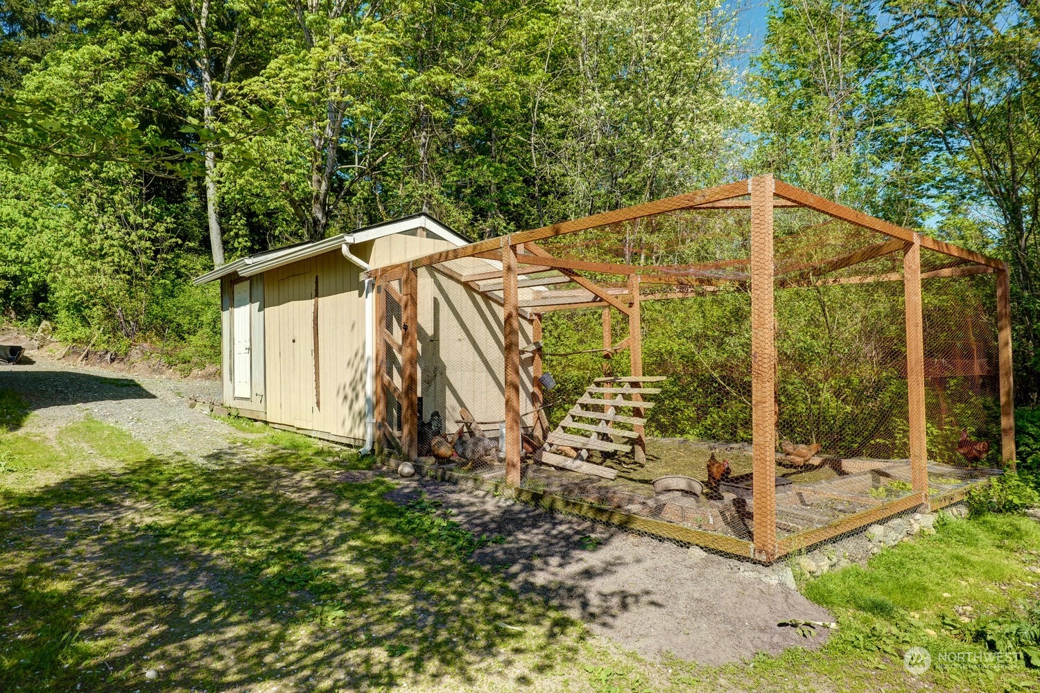 1722 Sunday Lake Road Stanwood, WA 98292 - Photo 26 of 32 a view of a house with backyard and trees