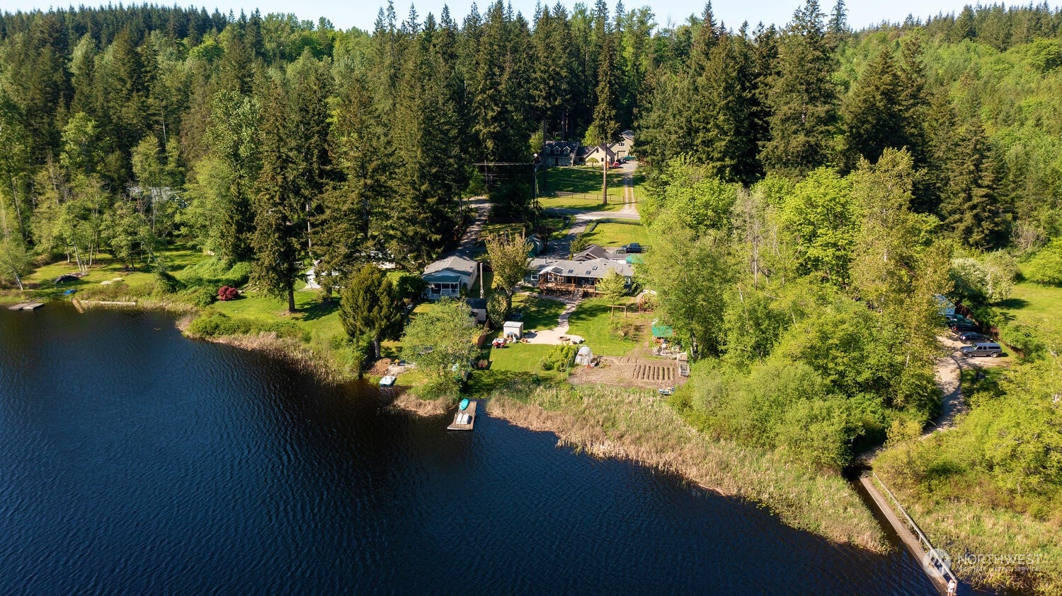1722 Sunday Lake Road Stanwood, WA 98292 - Photo 32 of 32 a view of a lake with a yard