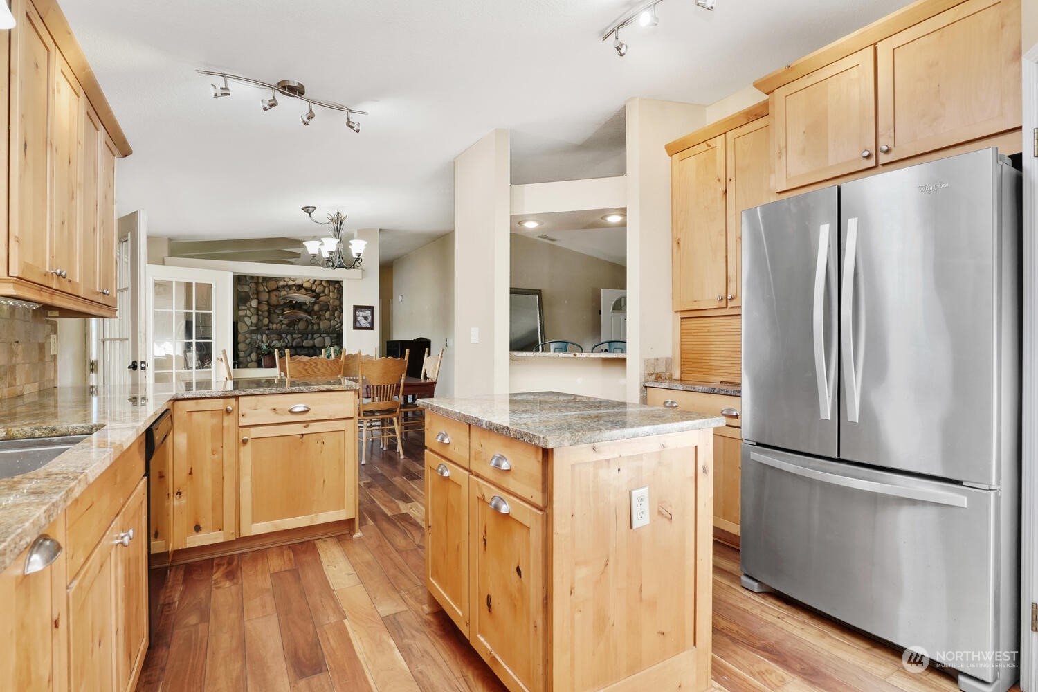 1722 Sunday Lake Road Stanwood, WA 98292 - Photo 9 of 32 a kitchen with stainless steel appliances a refrigerator sink and cabinets