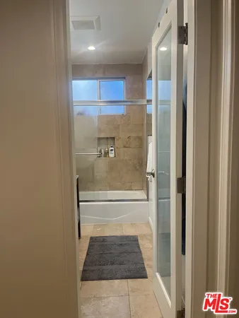 a bathroom with a sink vanity and a mirror