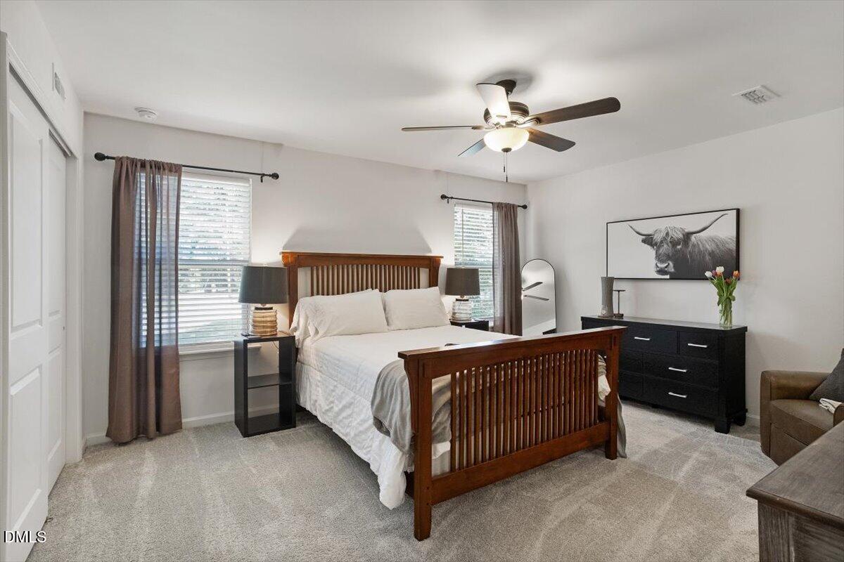 517 Hacksaw Trail Raleigh, NC 27610 - Photo 12 of 20 a bedroom with a bed and a dresser