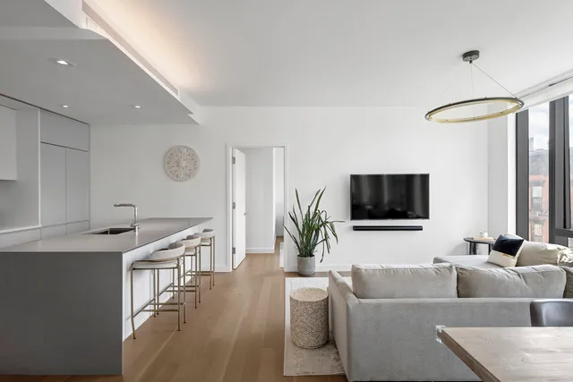a living room with fireplace furniture and a flat screen tv