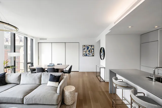 a view of a dining room with furniture and window