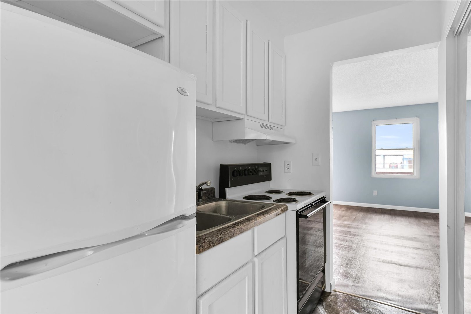 1740-1760 South Fairview Avenue Decatur, IL 62521 - Photo 18 of 26 a kitchen with cabinets appliances and a window