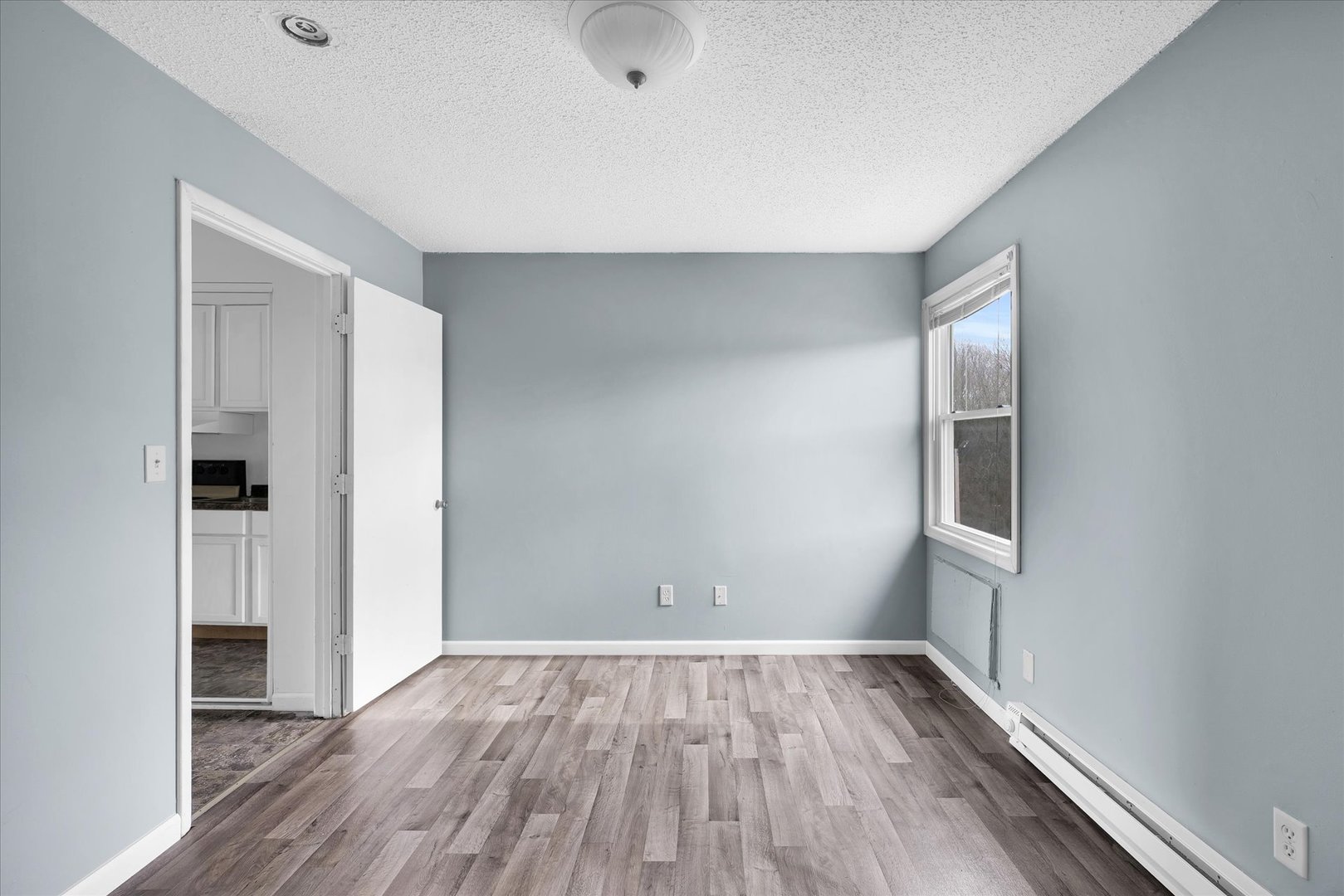 1740-1760 South Fairview Avenue Decatur, IL 62521 - Photo 20 of 26 a view of empty room with wooden floor and fan