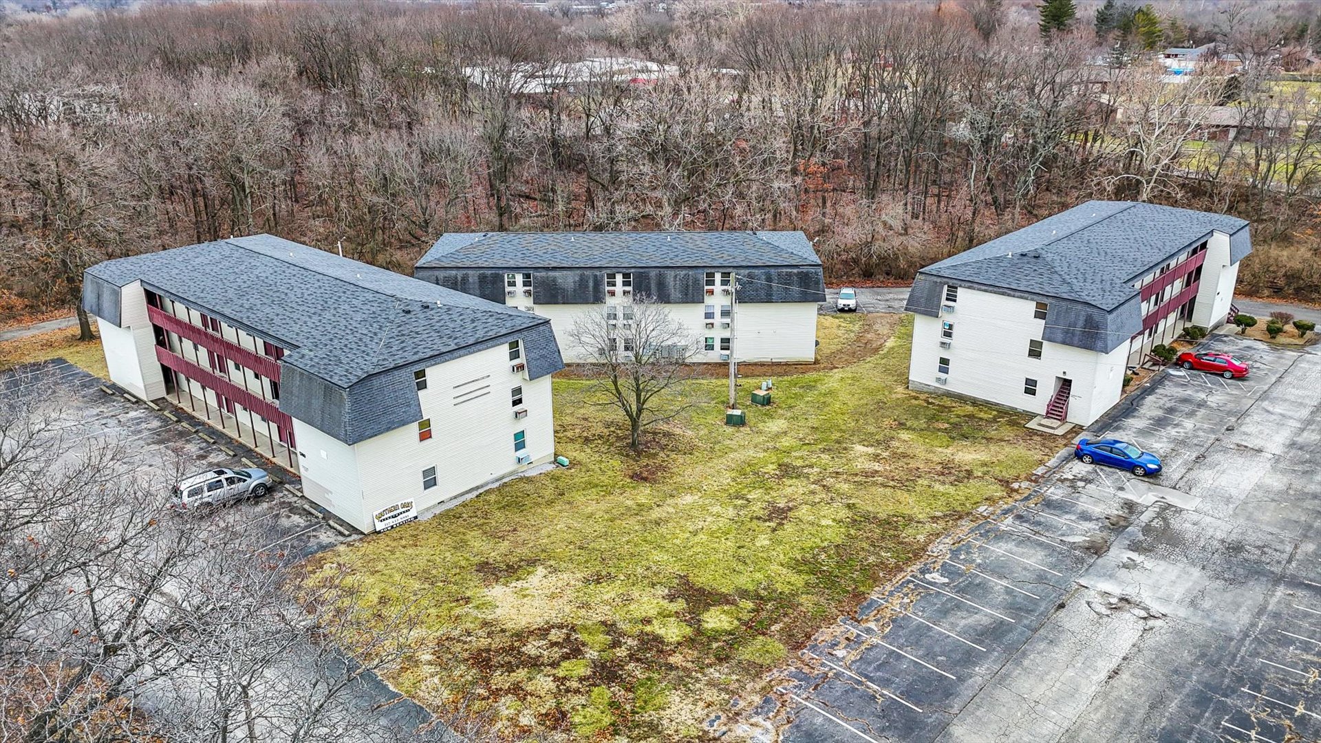 1740-1760 South Fairview Avenue Decatur, IL 62521 - Photo 2 of 26 an aerial view of a house with swimming pool and large trees