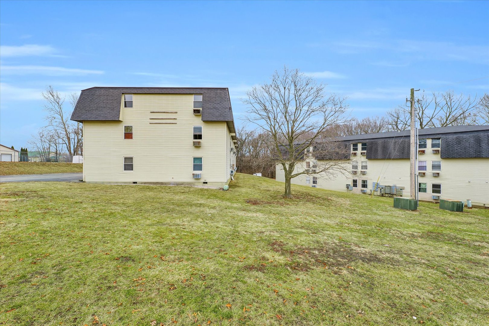 1740-1760 South Fairview Avenue Decatur, IL 62521 - Photo 22 of 26 a view of a white house with a yard