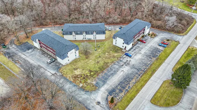 an aerial view of a house with a swimming pool