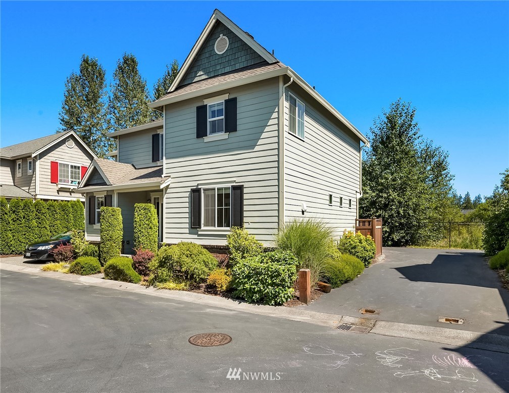 3617 183rd Place Southeast Bothell, WA 98012 - Photo 2 of 27 a front view of a house with a yard and potted plants