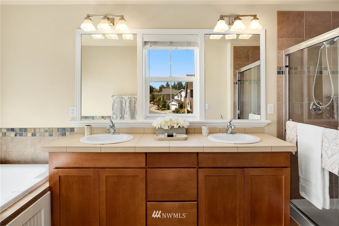 3617 183rd Place Southeast Bothell, WA 98012 - Photo 16 of 27 a bathroom with a sink and a mirror