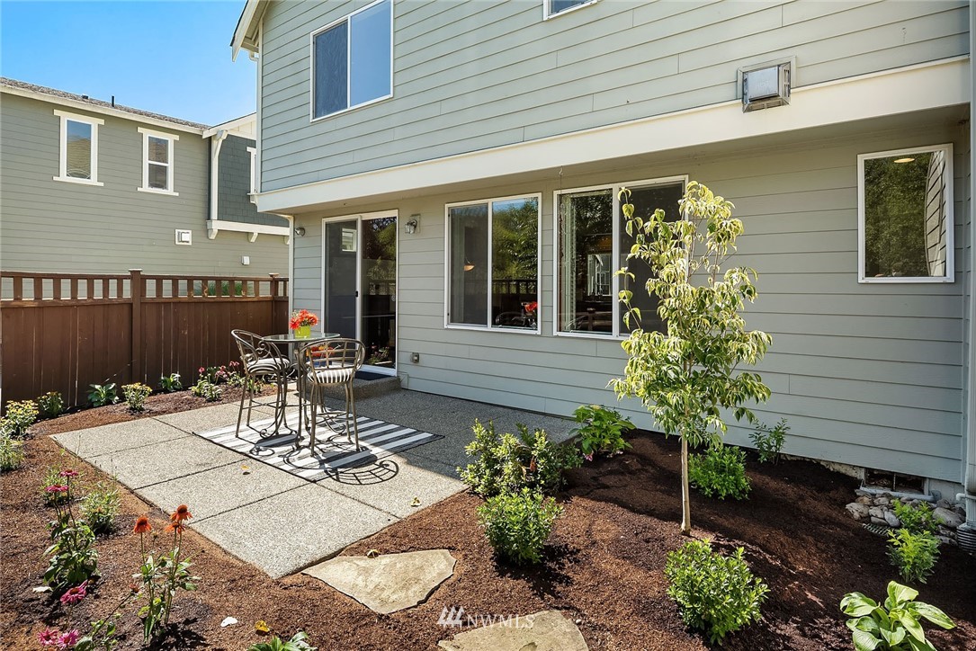 3617 183rd Place Southeast Bothell, WA 98012 - Photo 26 of 27 a view of a patio with table and chairs and potted plants