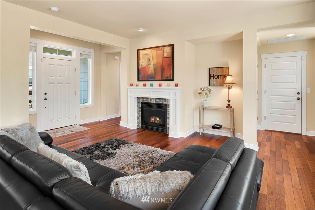 3617 183rd Place Southeast Bothell, WA 98012 - Photo 4 of 27 a living room with furniture and a fireplace