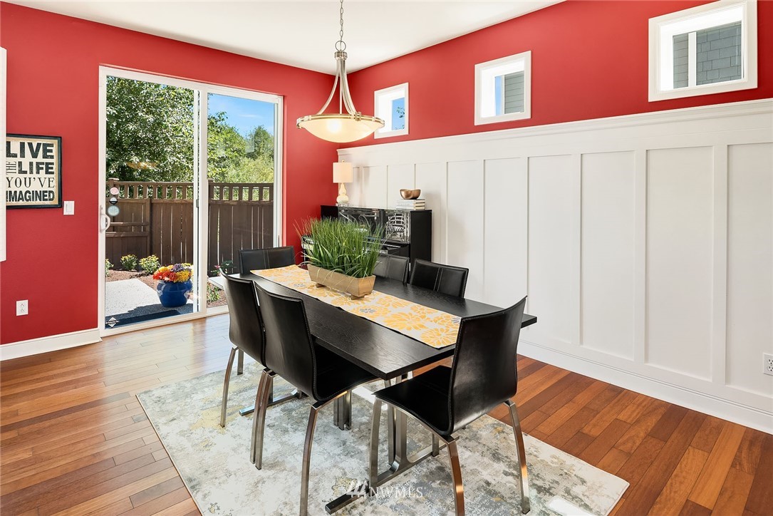 3617 183rd Place Southeast Bothell, WA 98012 - Photo 8 of 27 a dining room with furniture a chandelier and wooden floor