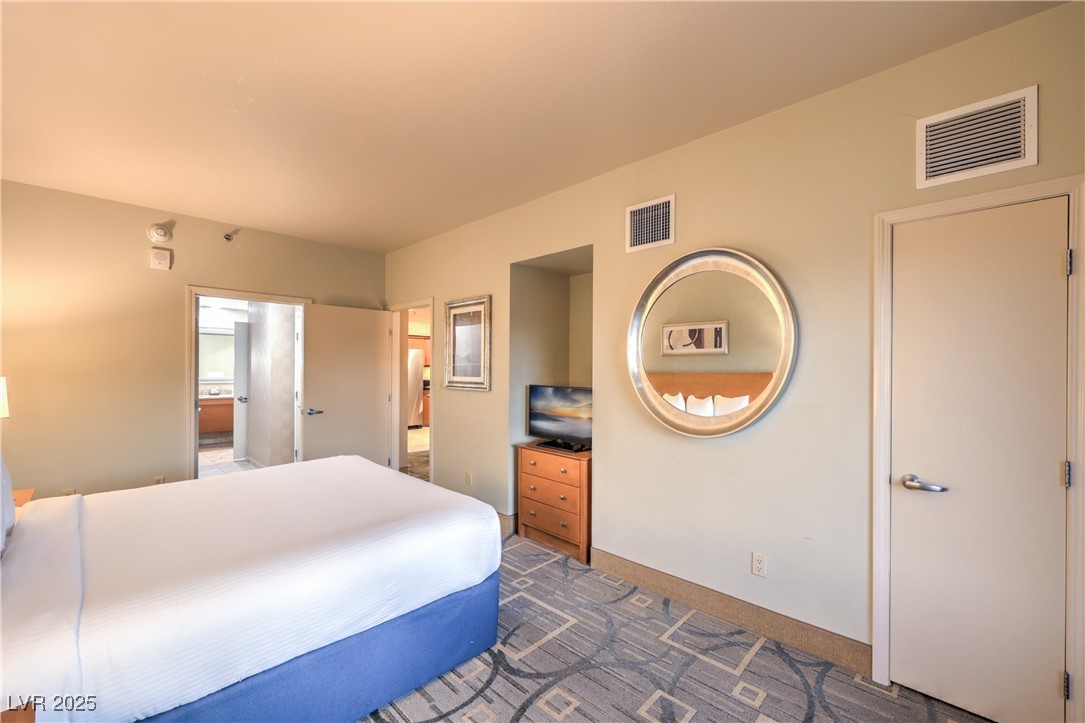 211 East Flamingo Road, Unit 1402 Las Vegas, NV 89169 - Photo 22 of 43 Carpeted bedroom with baseboards