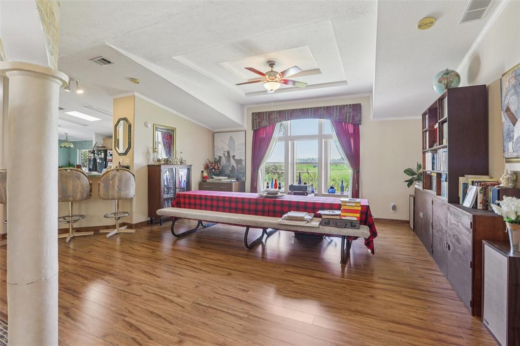29235 Bayhead Road Dade City, FL 33523 - Photo 12 of 71 a living room with furniture pool table wooden floor and windows