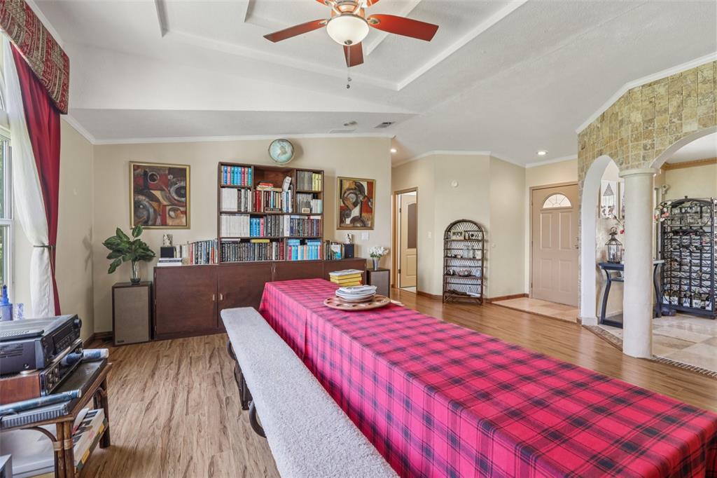 29235 Bayhead Road Dade City, FL 33523 - Photo 13 of 71 a living room with furniture fireplace and wooden floor