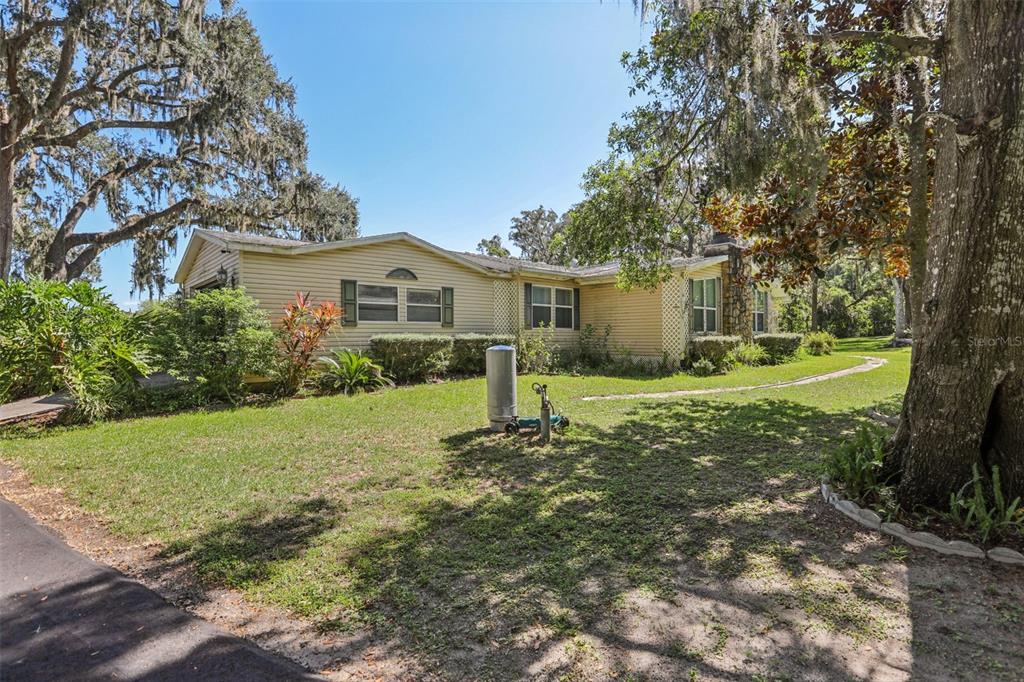 29235 Bayhead Road Dade City, FL 33523 - Photo 2 of 71 a front view of a house with garden
