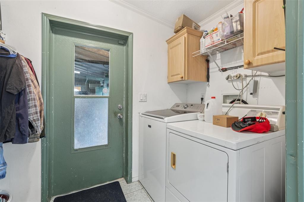 29235 Bayhead Road Dade City, FL 33523 - Photo 25 of 71 a utility room with dryer and washer