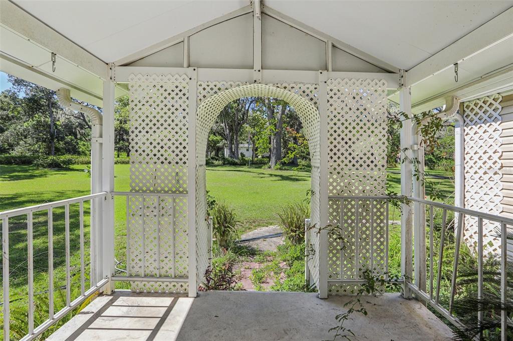 29235 Bayhead Road Dade City, FL 33523 - Photo 5 of 71 a front view of a house with a garden