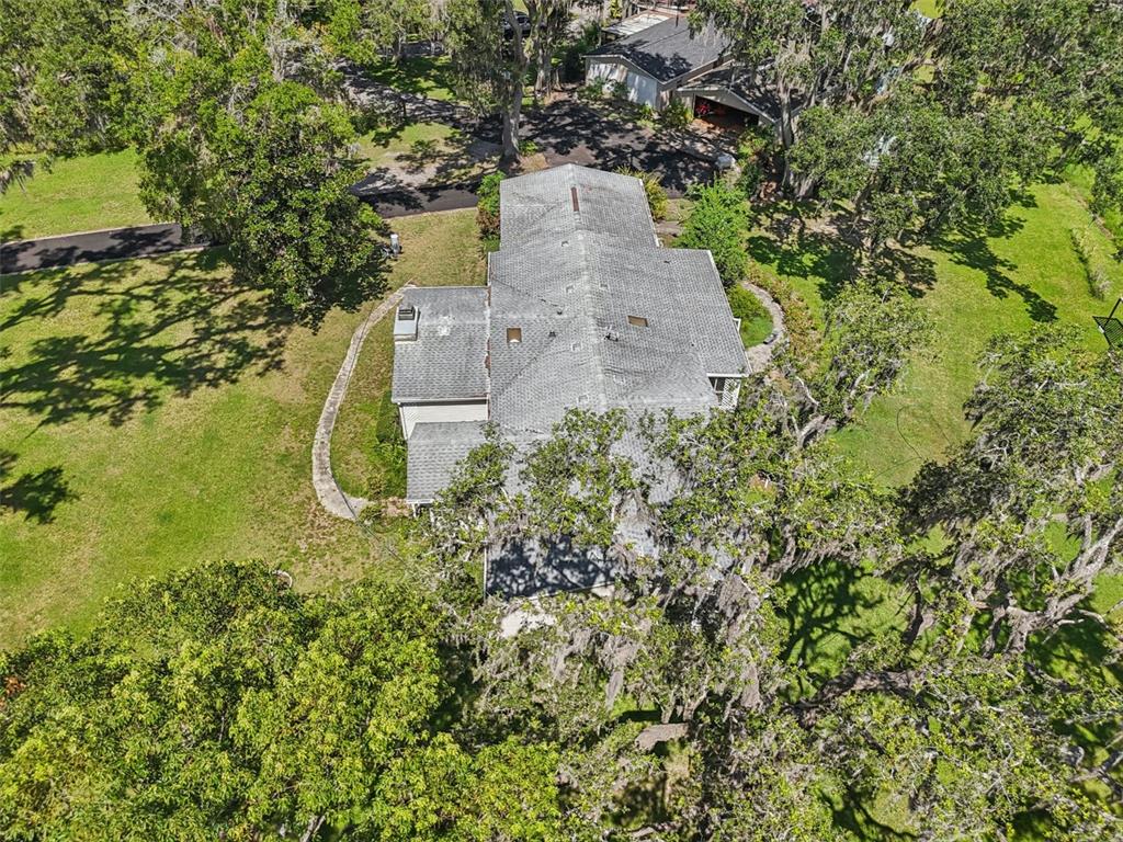 29235 Bayhead Road Dade City, FL 33523 - Photo 58 of 71 an aerial view of a house with a yard and trees all around