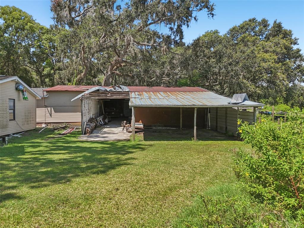 29235 Bayhead Road Dade City, FL 33523 - Photo 67 of 71 a front view of a house with garden