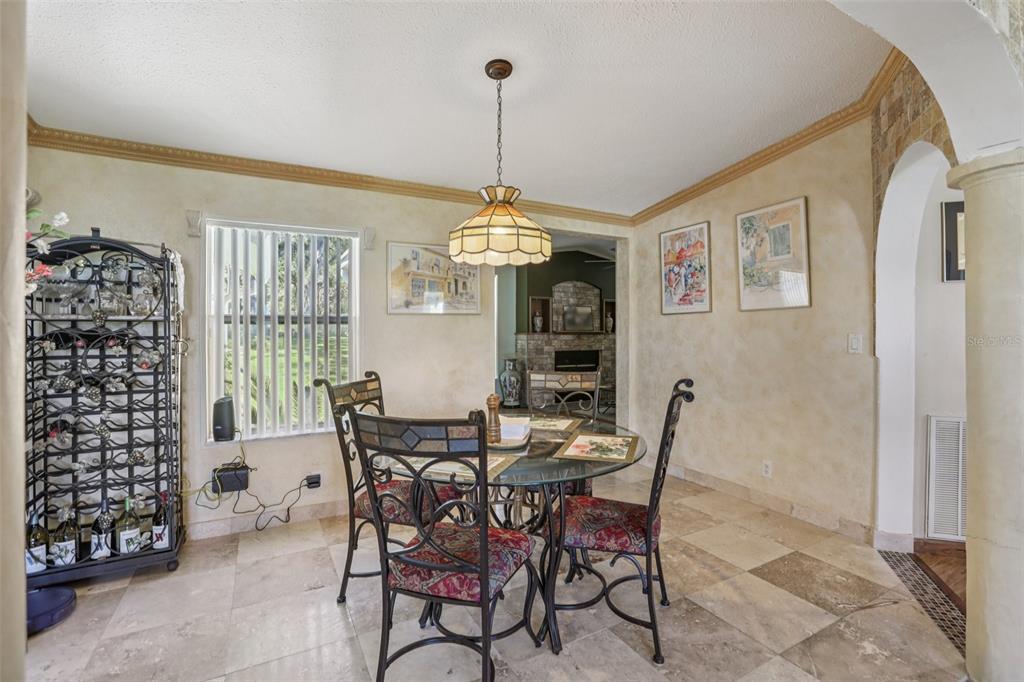 29235 Bayhead Road Dade City, FL 33523 - Photo 8 of 71 a view of a dining room with furniture window and wooden floor