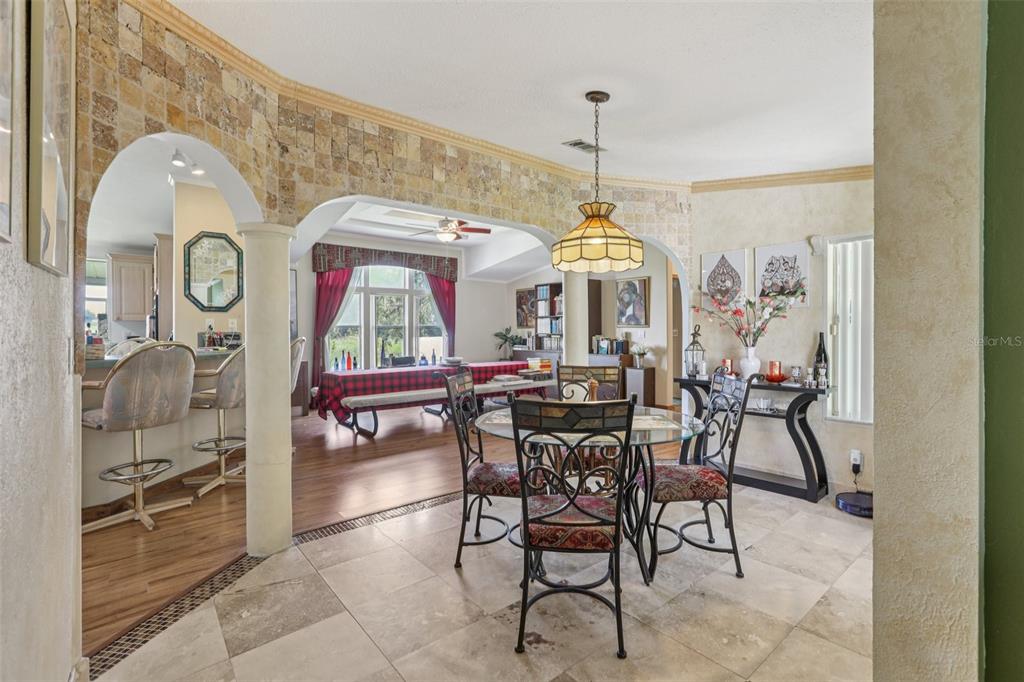 29235 Bayhead Road Dade City, FL 33523 - Photo 9 of 71 a view of a dining room with furniture and a chandelier