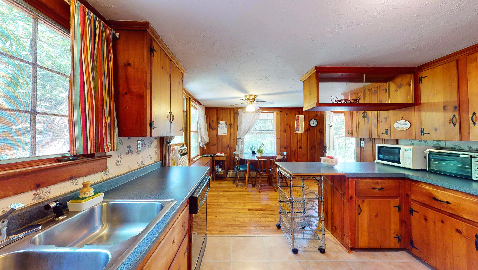 6 South Highland Road Truro, MA 02666 - Photo 11 of 27 a kitchen with large windows and furniture