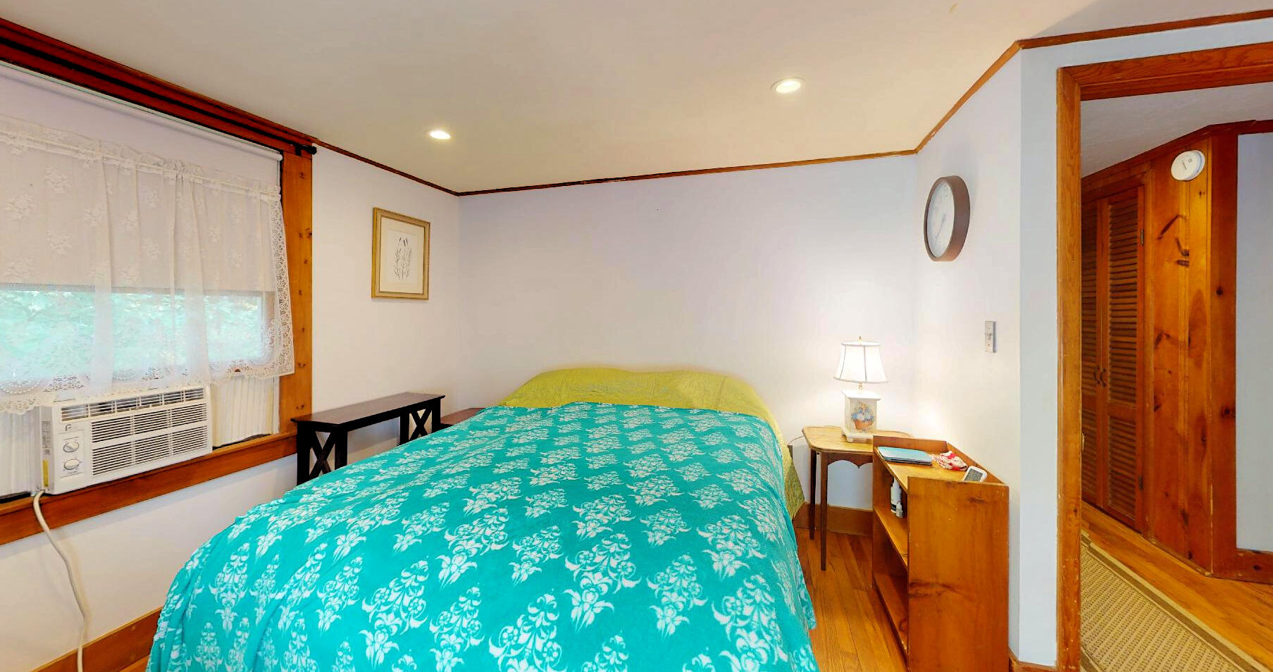 6 South Highland Road Truro, MA 02666 - Photo 20 of 27 a bedroom with a bed and a dresser next to a window
