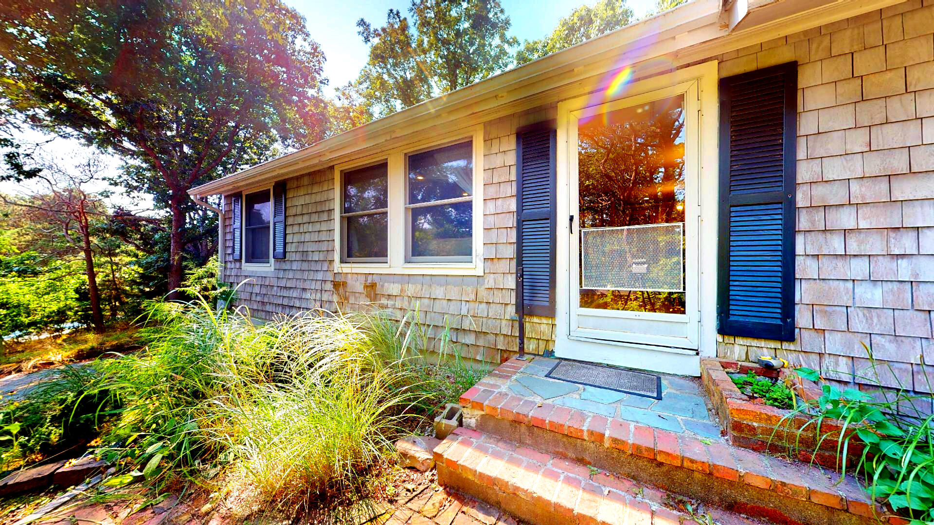6 South Highland Road Truro, MA 02666 - Photo 2 of 27 a backyard of a house with seating space