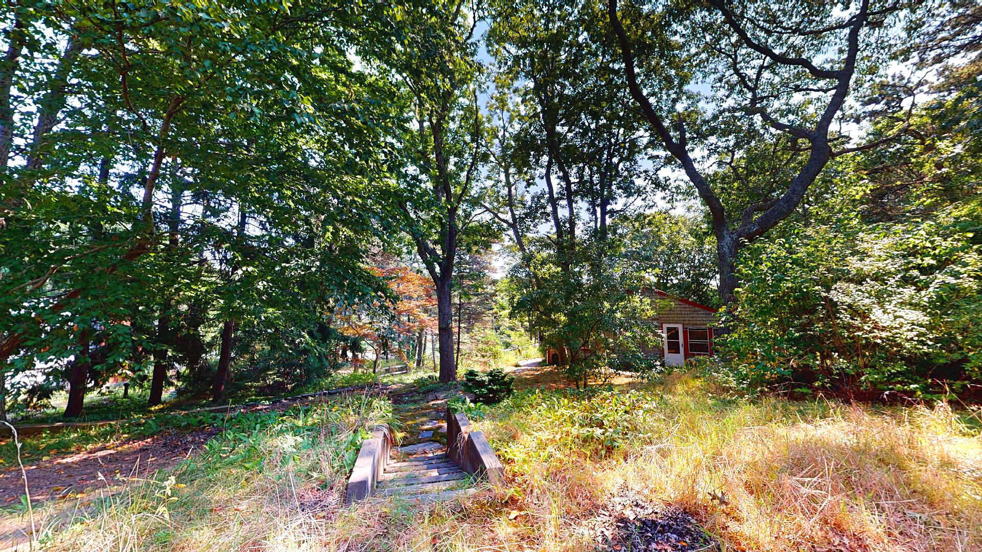 6 South Highland Road Truro, MA 02666 - Photo 24 of 27 a backyard of a house with yard and outdoor seating