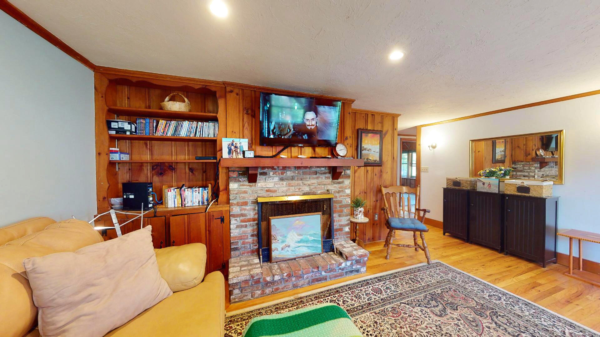 6 South Highland Road Truro, MA 02666 - Photo 3 of 27 a living room with furniture a rug and a fireplace