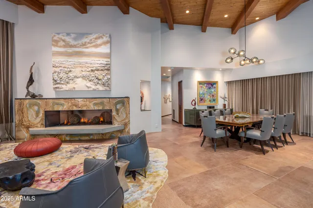 a view of walk in closet with clothes