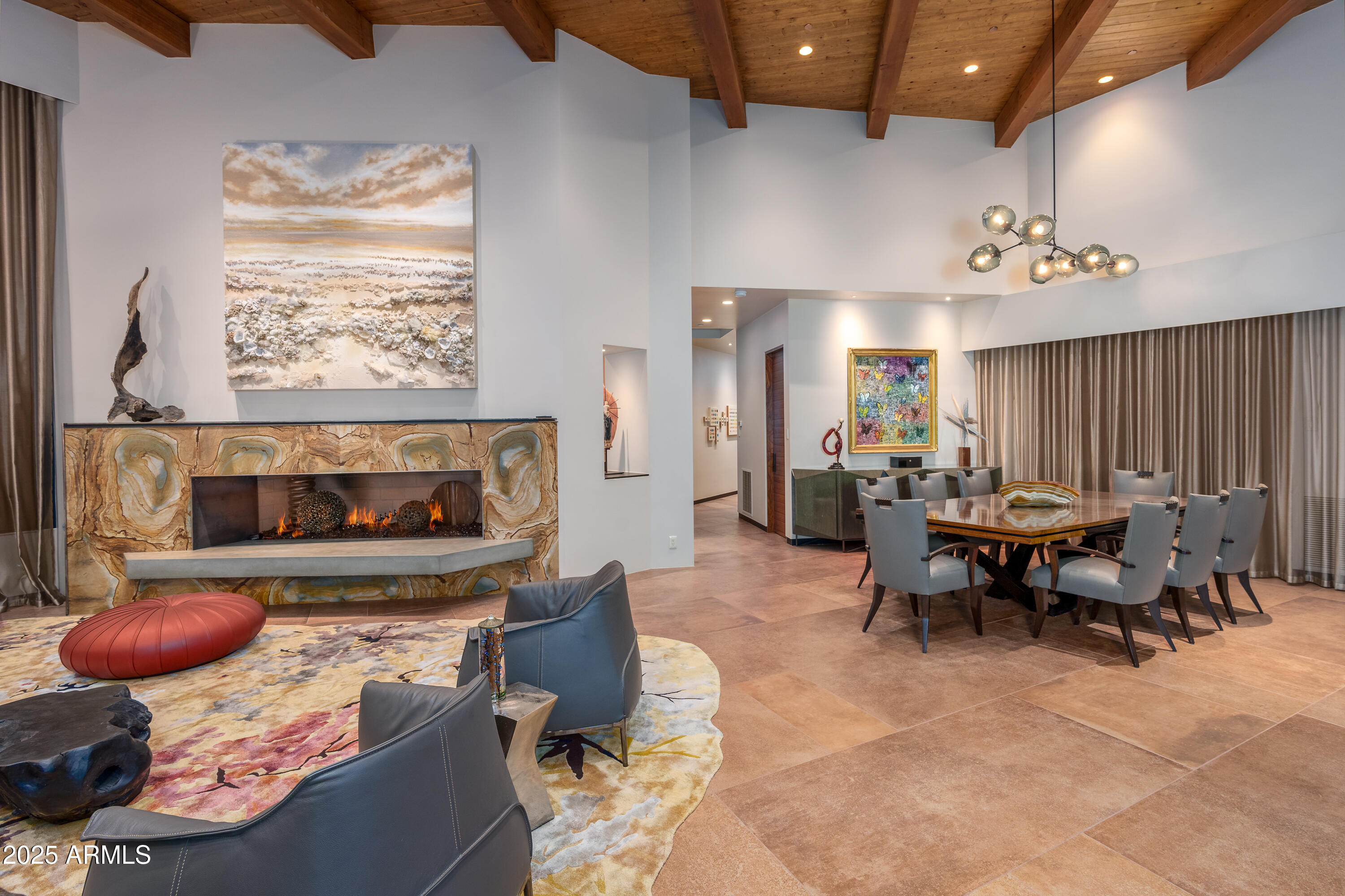 120 Paisano Road Sedona, AZ 86336 - Photo 14 of 63 a living room with furniture and a fireplace