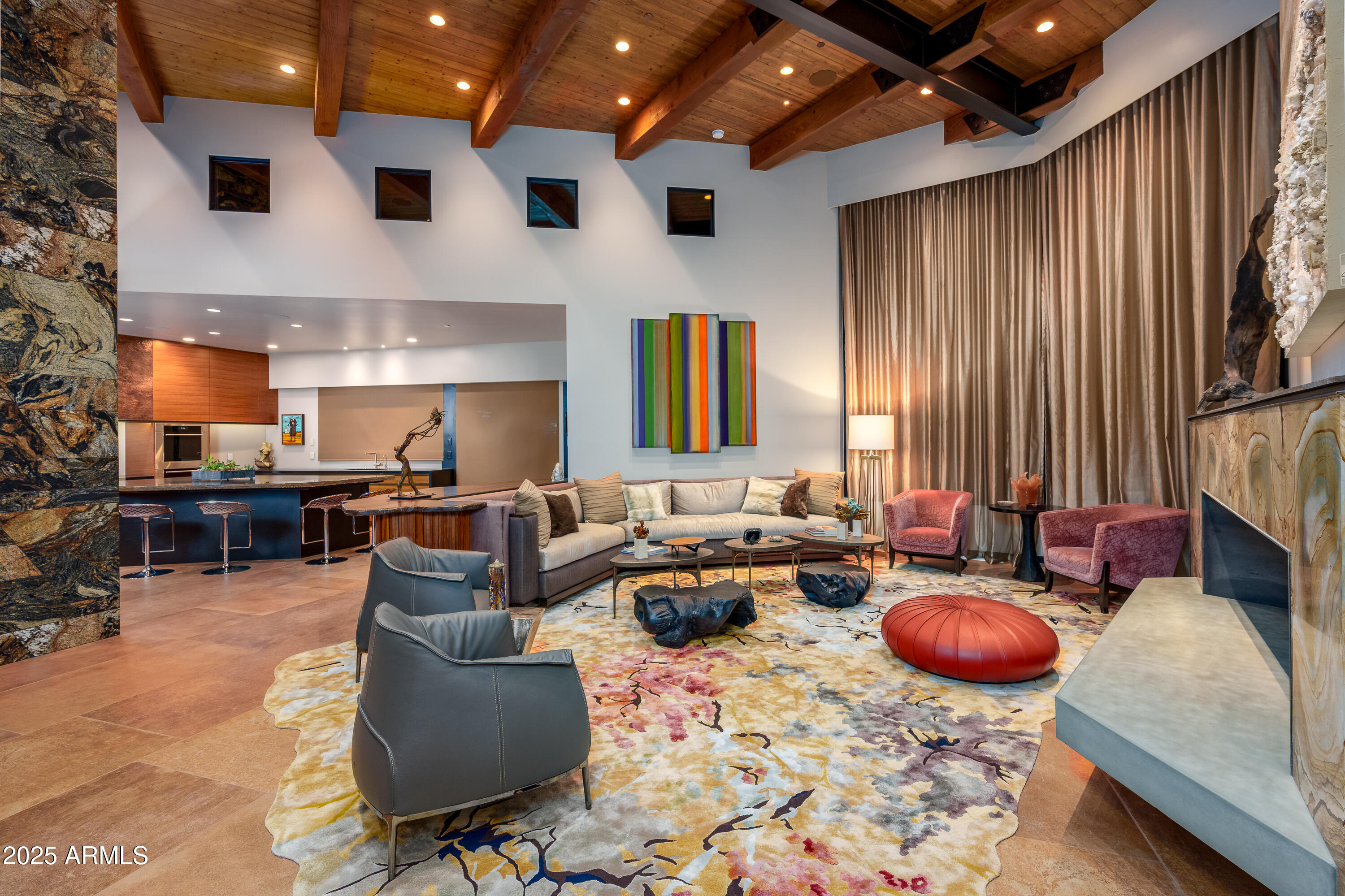 120 Paisano Road Sedona, AZ 86336 - Photo 15 of 63 a living room with furniture a rug and a fireplace